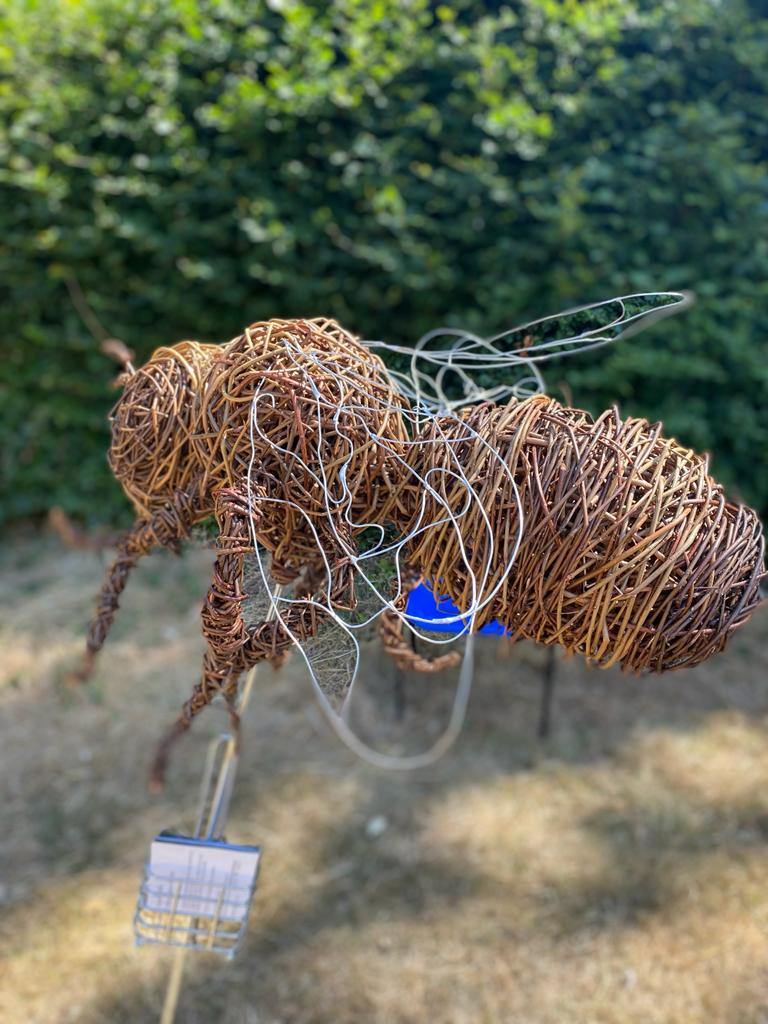 wicker sculpture of a bee